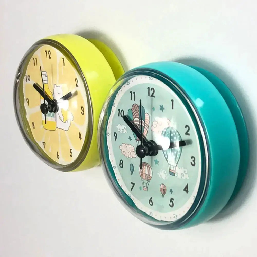 Mini Sucker wall clocks pair in yellow and teal, waterproof small quartz bathroom clocks by Simples Market