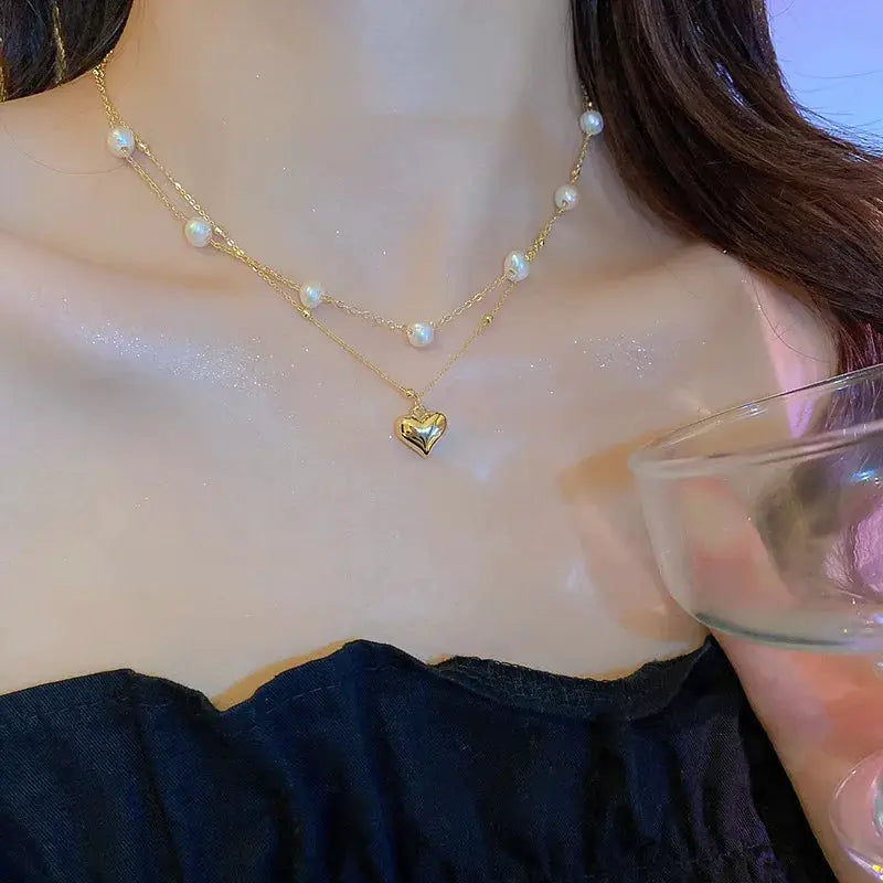 Gold-tone pearl choker necklace with heart pendant, double-layer chain for women