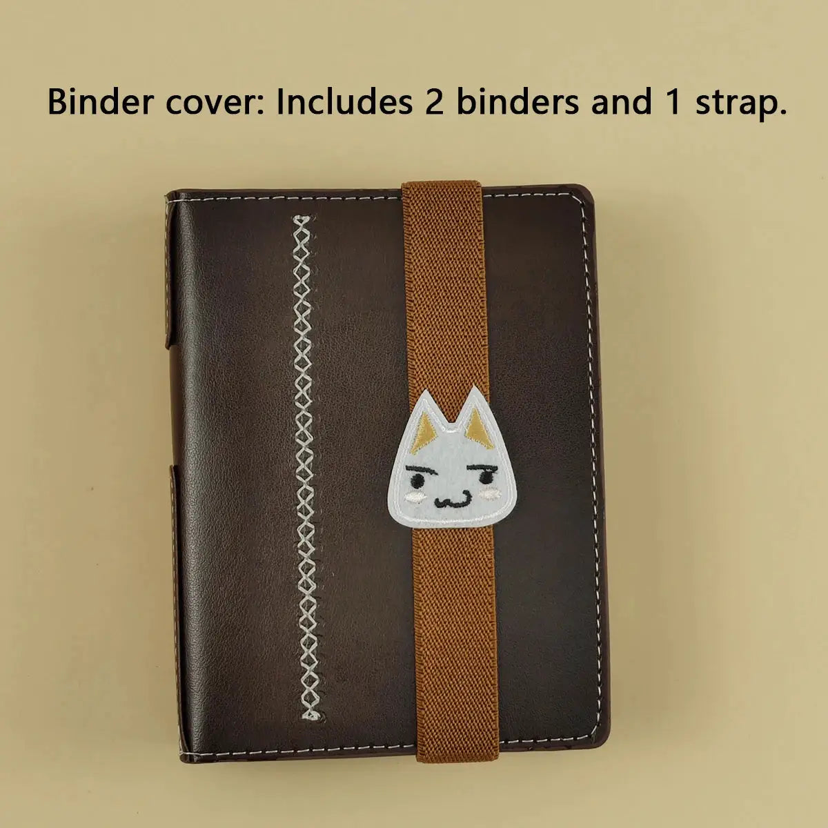 Two dark brown faux leather A7 binders with an orange elastic strap, featuring a white cat emblem and white stitching