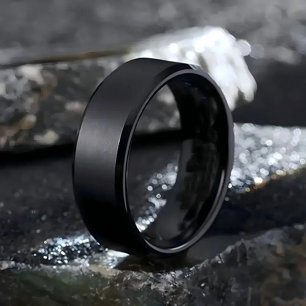 Unisex stainless steel ring with black matte finish, sleek fashion jewelry for men and women.