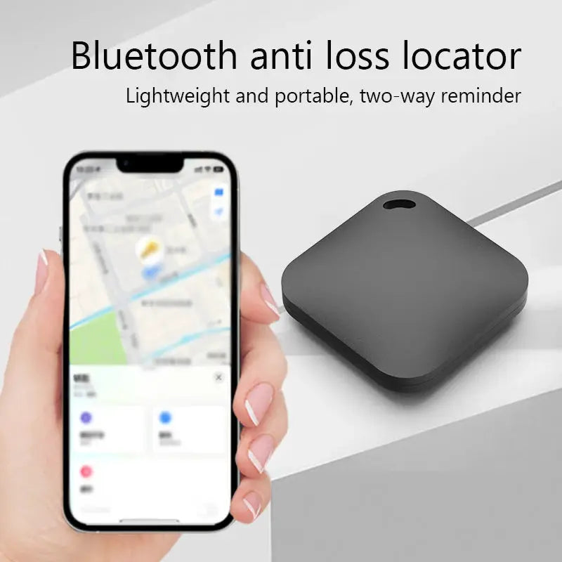 Smart Bluetooth GPS tracker, black square device that works with Find My app, shown with map on iPhone