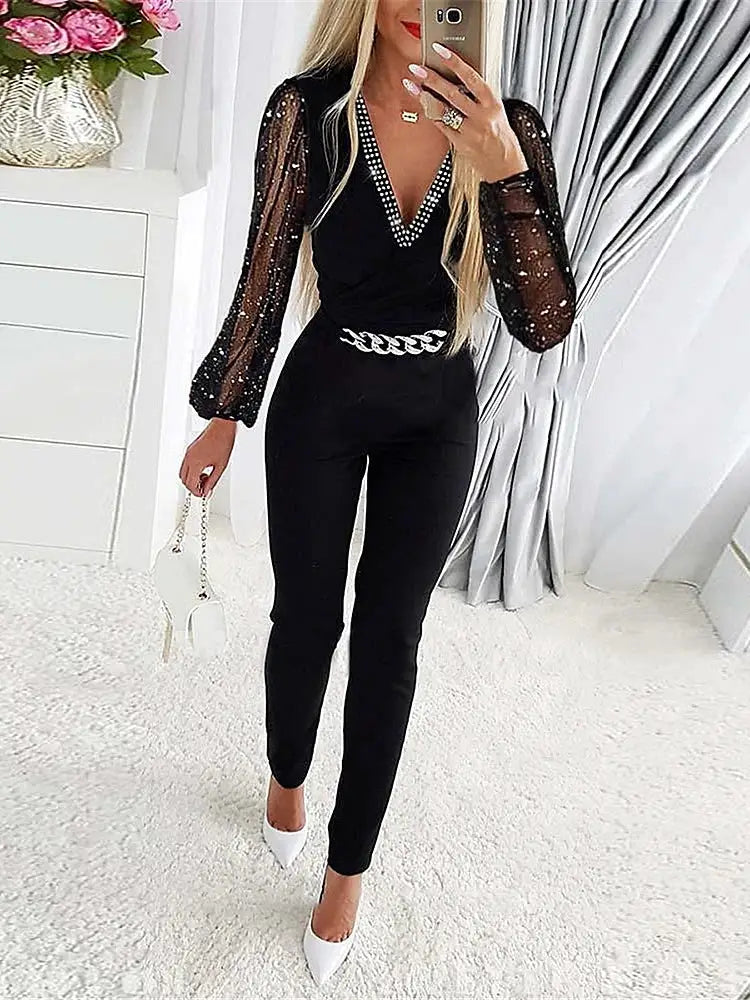 Simples Market women's black jumpsuit with V-neck rhinestone trim and sheer dotted sleeves, high waist, slim-fit.