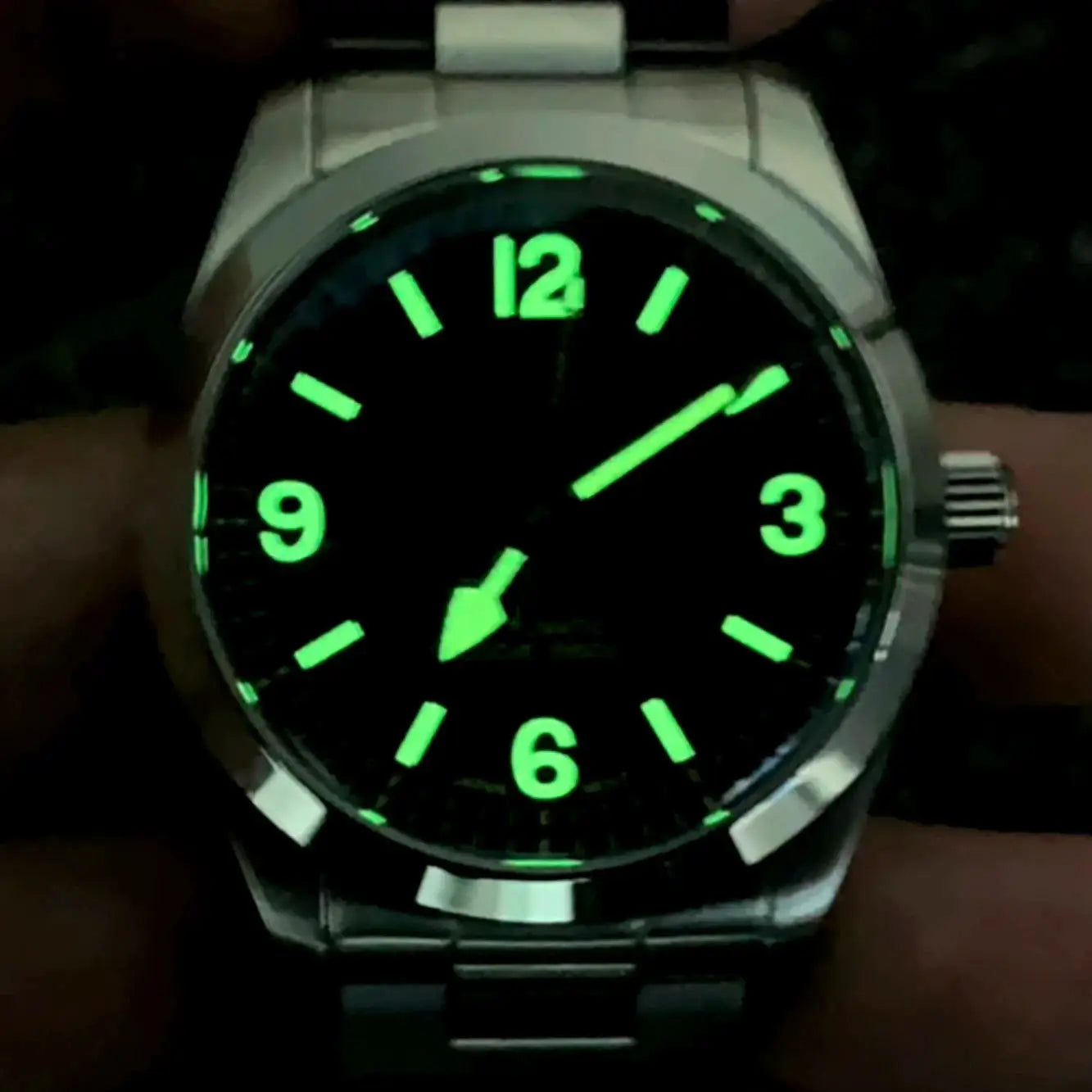 PAGANI DESIGN 36mm automatic watch with stainless steel case and bracelet; black dial with green luminescent numerals