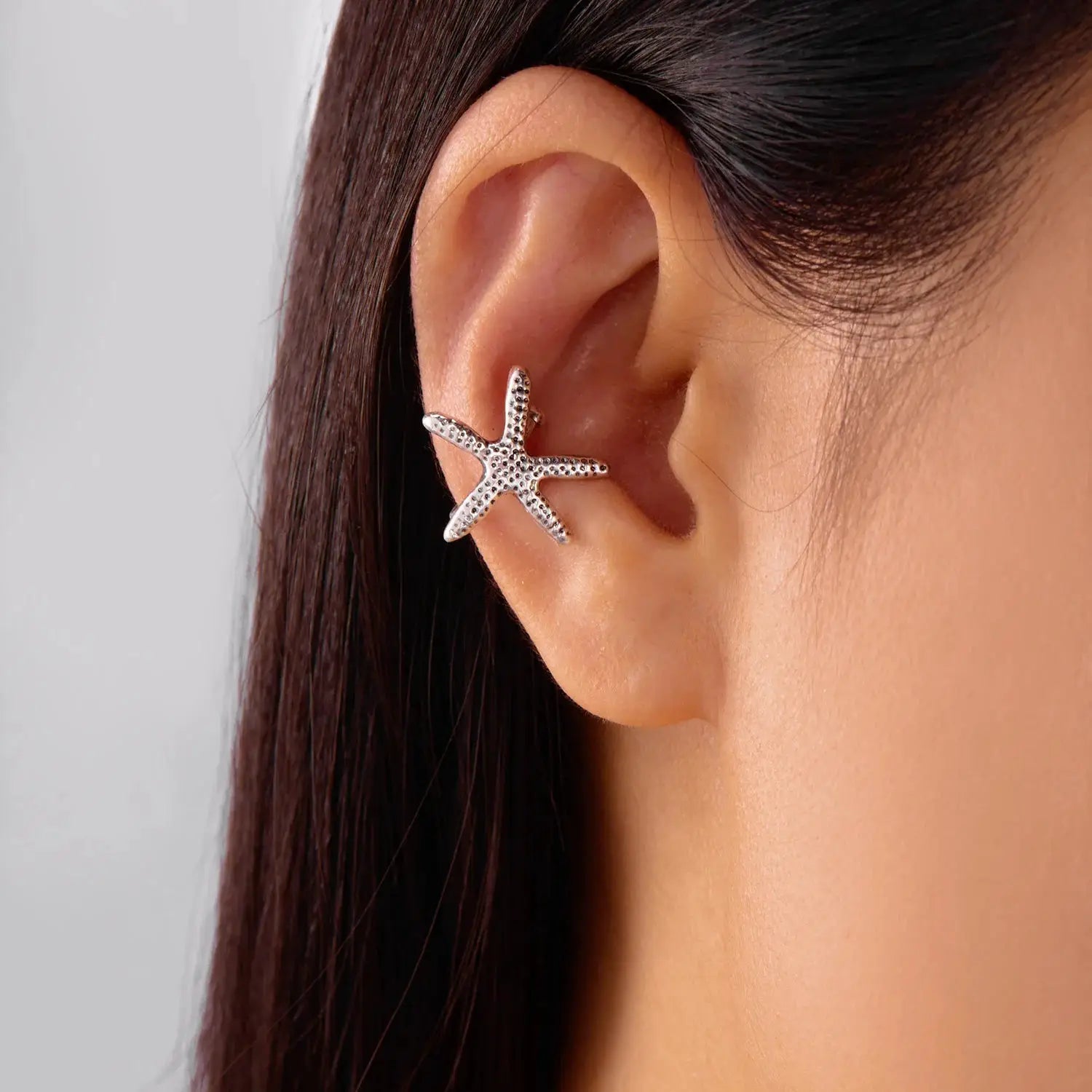 Starfish ear clip faux piercing earrings in silver-tone metal by Simples Market