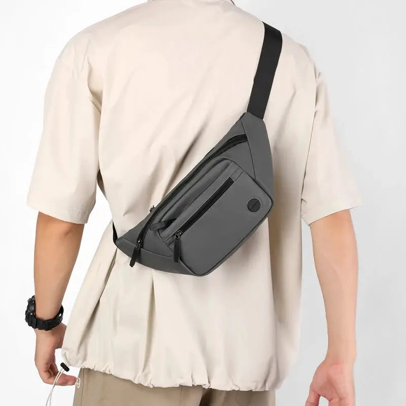 Unisex waterproof waist bag by Simples Market in gray, crossbody belt pack with multiple zip pockets.