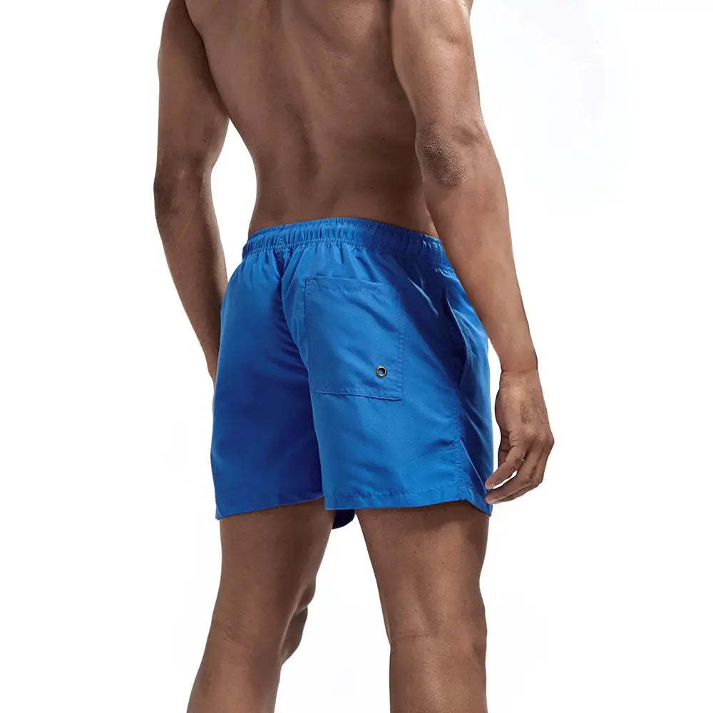 Men's blue quick-dry swim shorts with elastic waistband and back pocket