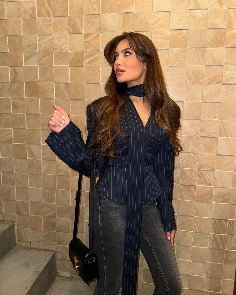 Trendix Elegant blazer 2 piece set for women in navy pinstripe, model wearing with scarf detail and black handbag