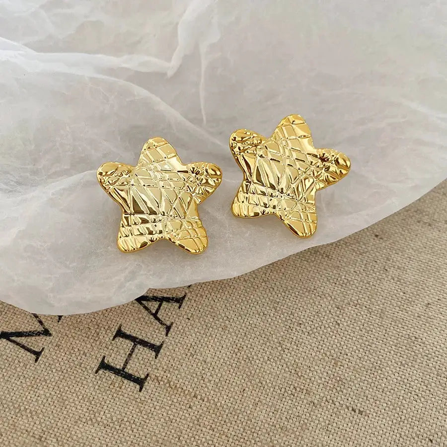 Gold-tone star-shaped textured stud earrings, unisex pair
