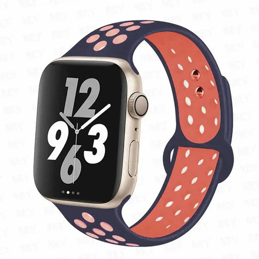Silicone Apple Watch Pride strap Simples Market; navy exterior with pink perforations, coral interior, universal 38-49mm