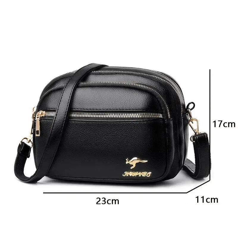 Black soft leather purse by Simples Market; crossbody shoulder handbag with multiple pockets and gold-tone hardware.