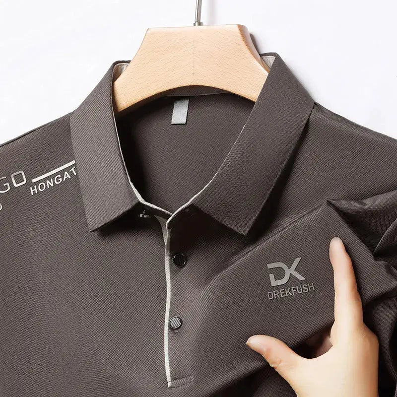 Men's dark gray polo shirt by DREKFUSH with white piping and chest logo