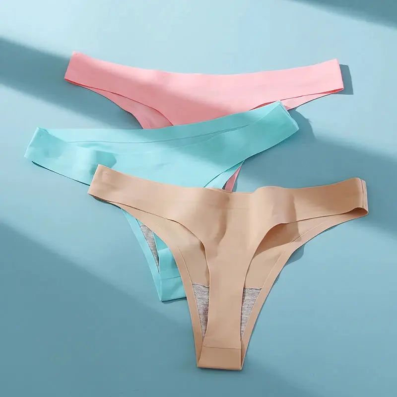 WarmSteps 3-pack seamless thong panties in pink, teal, and beige; low-rise with stretch fabric.