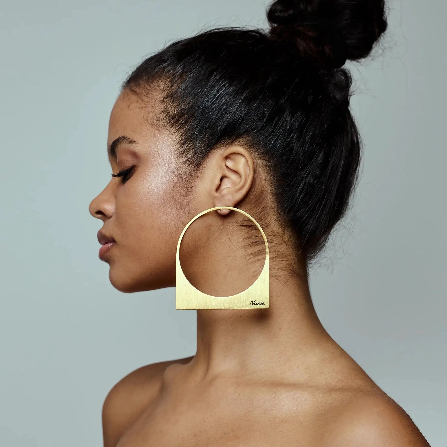 Large gold-plated stainless steel hoop earring with a rectangular name plate