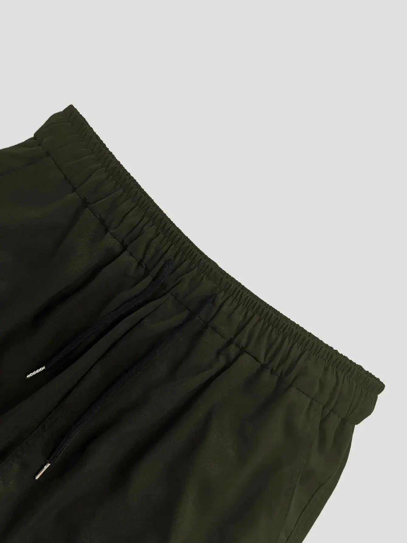 Men's olive green cargo pants with elastic drawstring waist and front zipper pockets