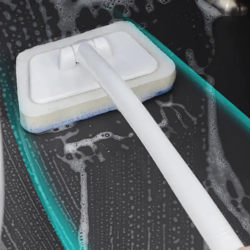 Bathroom sponge cleaning brush with long white handle and removable pad for tub and tile cleaning