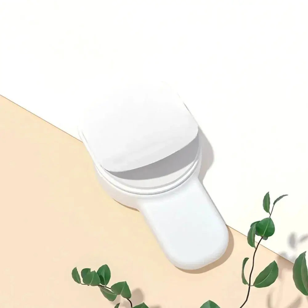 White plastic baby oven door lock for kitchen and microwave safety; anti-opening buckle fixator.