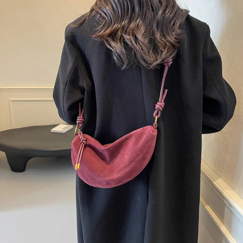 Faux suede dumpling-shaped shoulder crossbody bag by Simples Market in pink