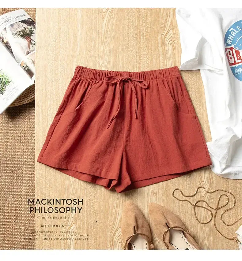 Women’s casual linen shorts in rust orange with high-waisted elastic drawstring waistband and pockets