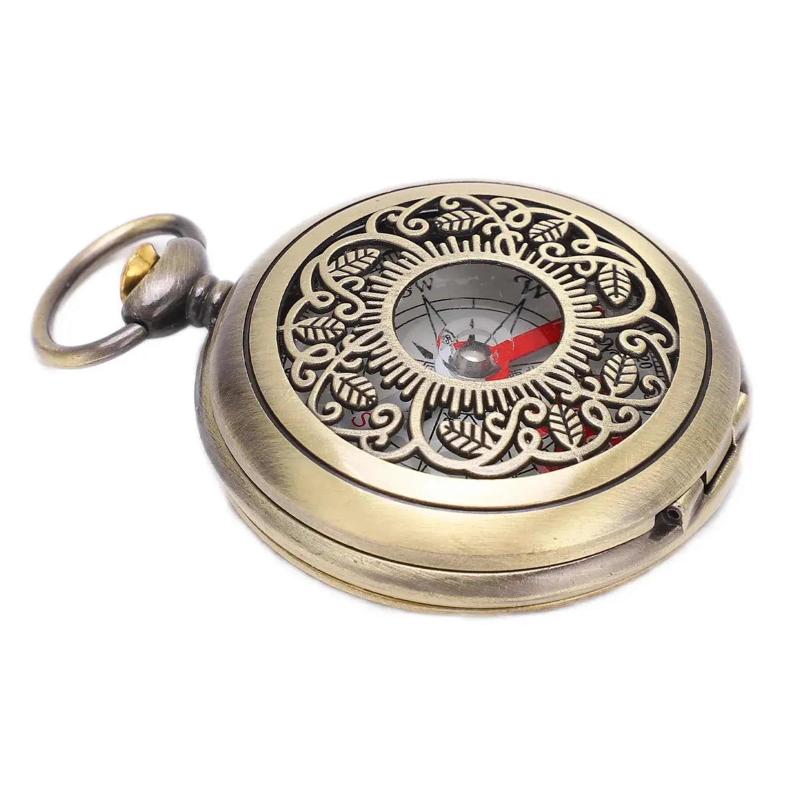 Brass pocket compass with ornate filigree cover and visible dial for portable outdoor navigation.