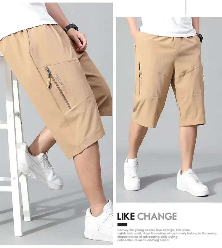 Mens cargo shorts knee-length, beige cotton with zip pockets and elastic waistband.