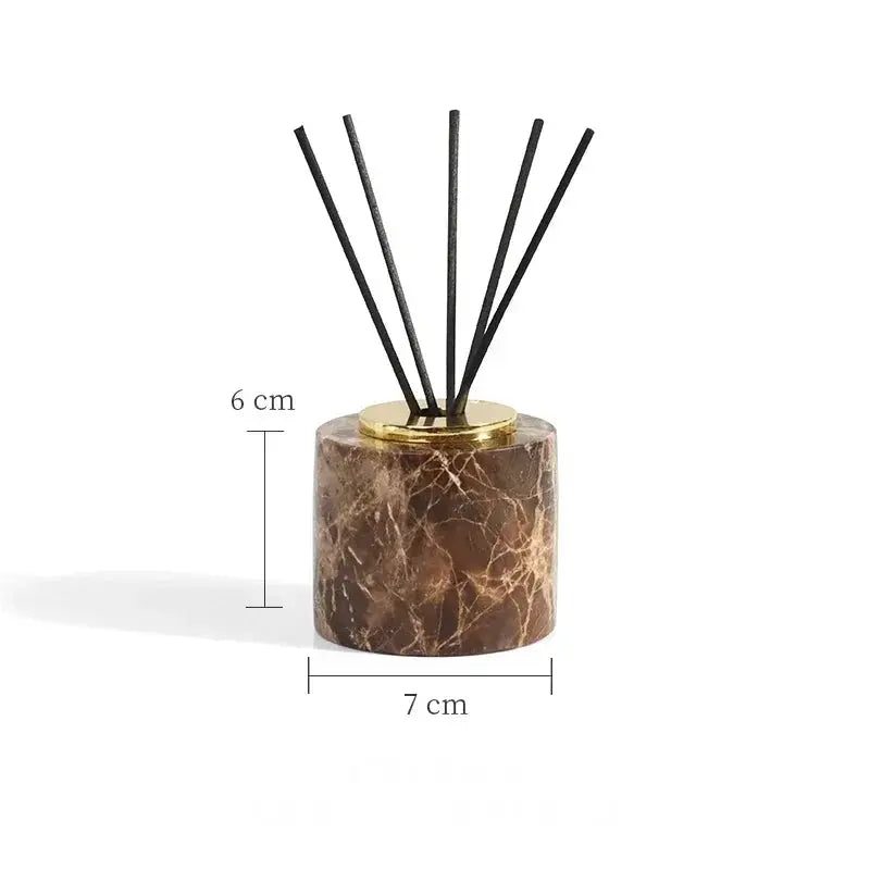 Simples Market Emperador Dark marble bathroom diffuser with brown marble base, gold cap, and black reeds