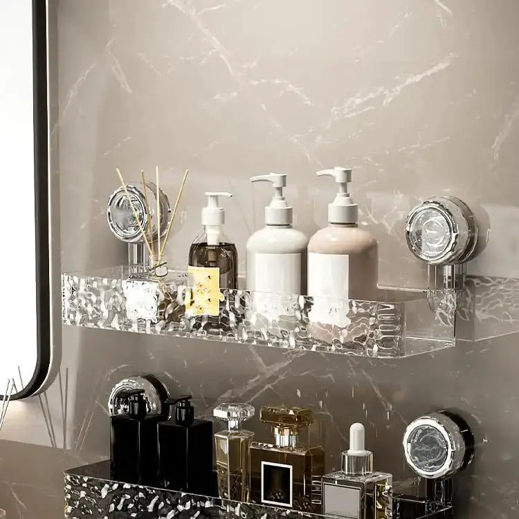 Corrugated suction cup storage shelf by Simples Market in clear acrylic with pump bottles.