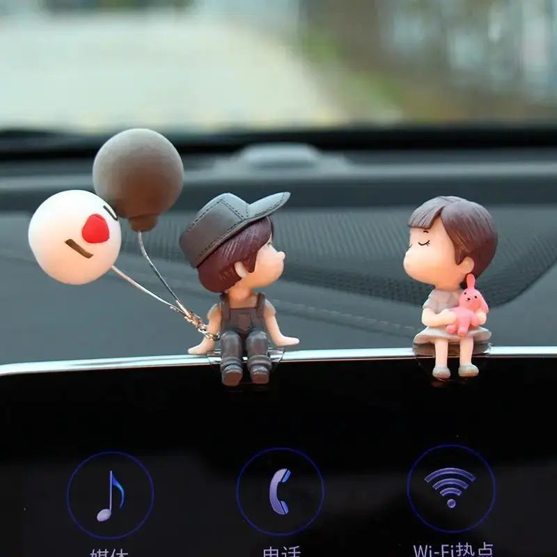 Car dashboard figurines: two cute cartoon couple with heart balloon ornament