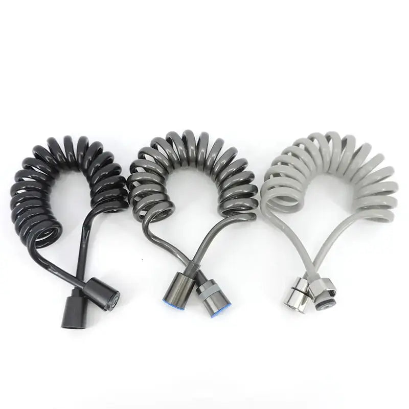Three coiled ABS handheld bidet spray hoses in black, gray, and light gray with spray nozzles