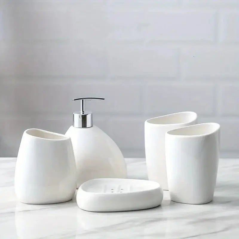 White ceramic bathroom accessory set, 4 pieces: soap dispenser, mouthwash cup, toothbrush holder, soap dish.
