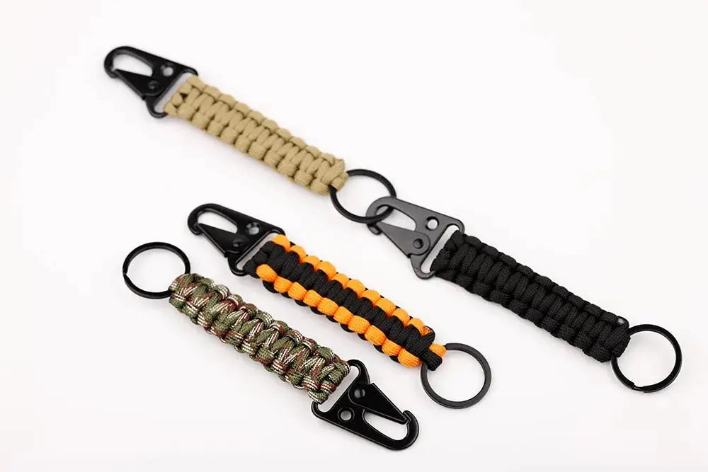 Paracord keychain set (4) with carabiner and bottle opener; tan, black, camo, and orange/black styles.