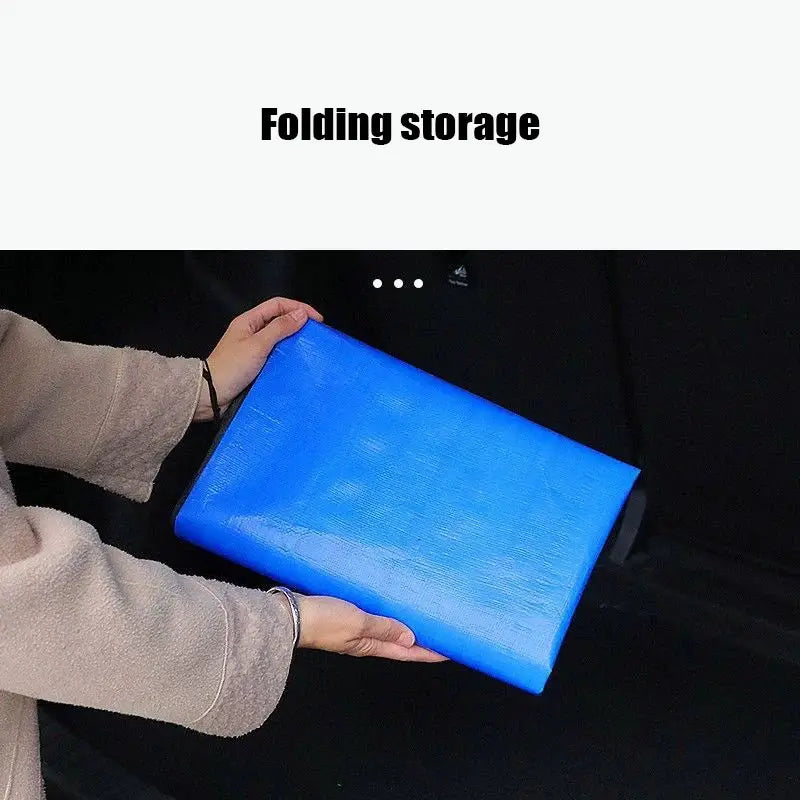 Universal car trunk mat, blue waterproof pet cargo liner being placed into a trunk