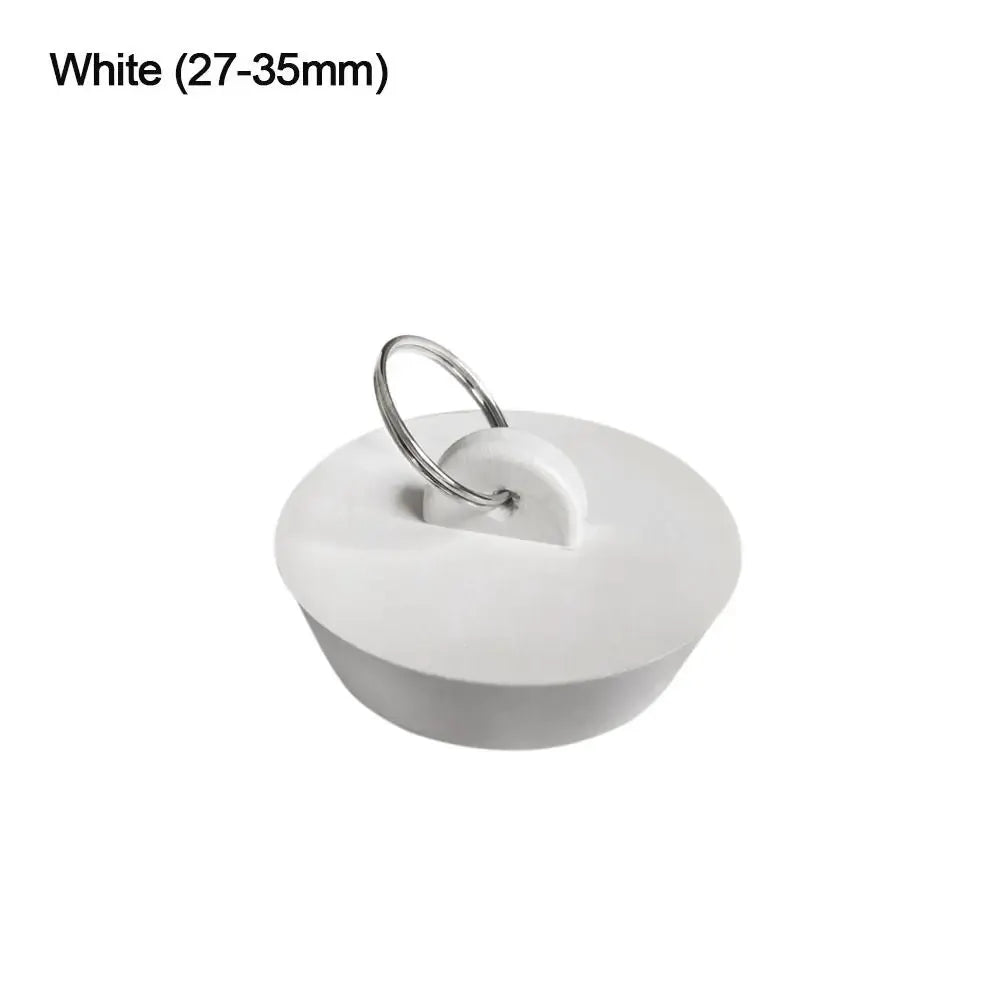 Rubber sink drain plug with metal ring, white, for bathroom and kitchen drains.
