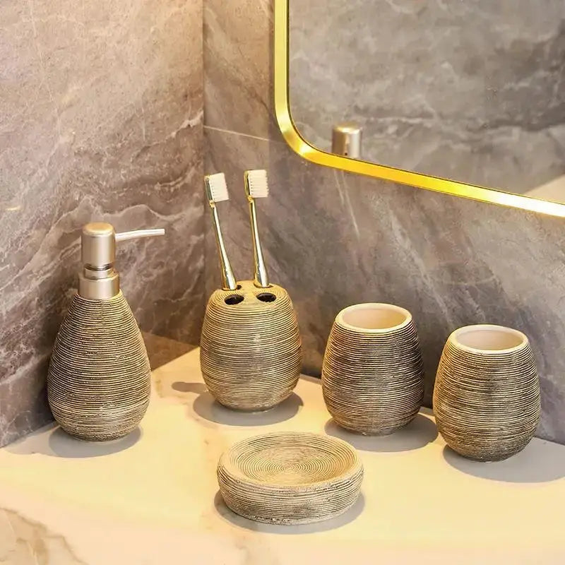 Ceramic bathroom set (5-piece) in ribbed gray-beige finish with dispenser, toothbrush holder, two cups, and soap dish.