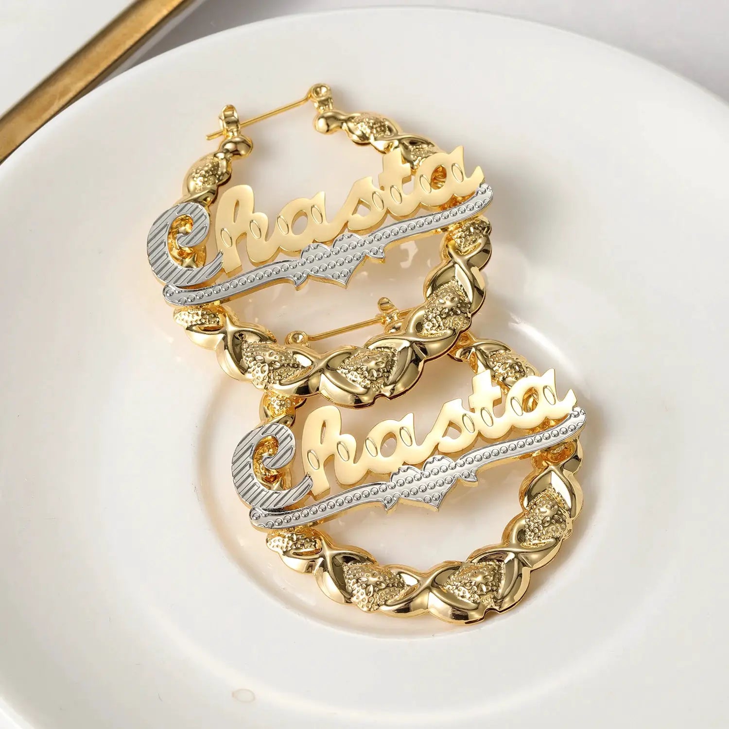Nameplate hoop earrings with two-tone gold and silver bamboo-link design and custom scripted name
