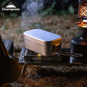 Aluminum lunch box by Simples Market on open-flame camping stove; silver metal with CampingMoon logo.