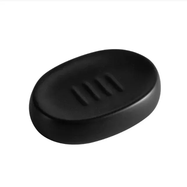Black oval toothbrush rack with three slots for bathroom use
