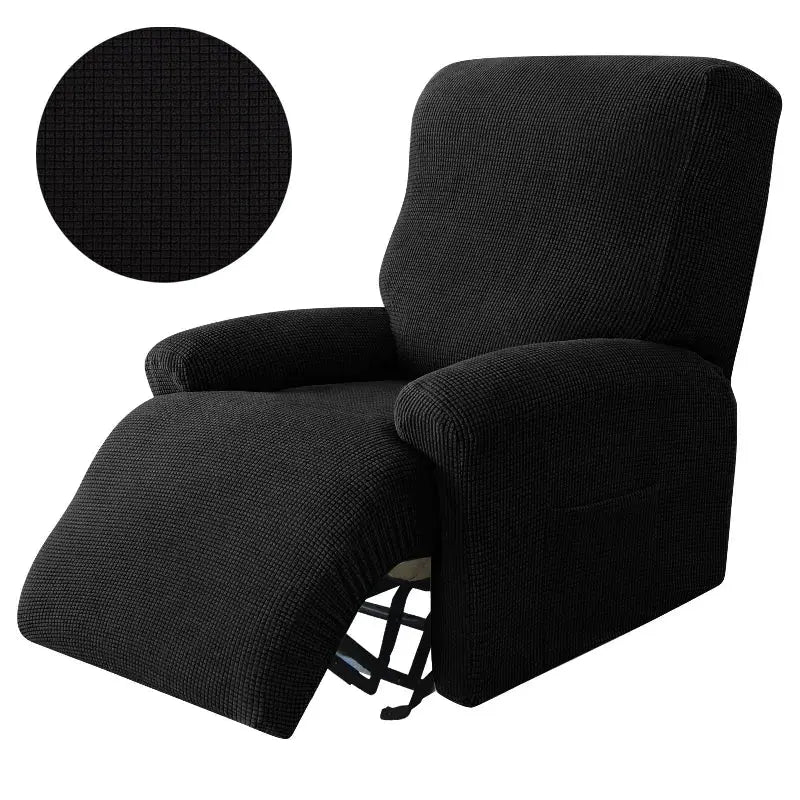 Recliner chair with black textured stretch slipcover; footrest extended.