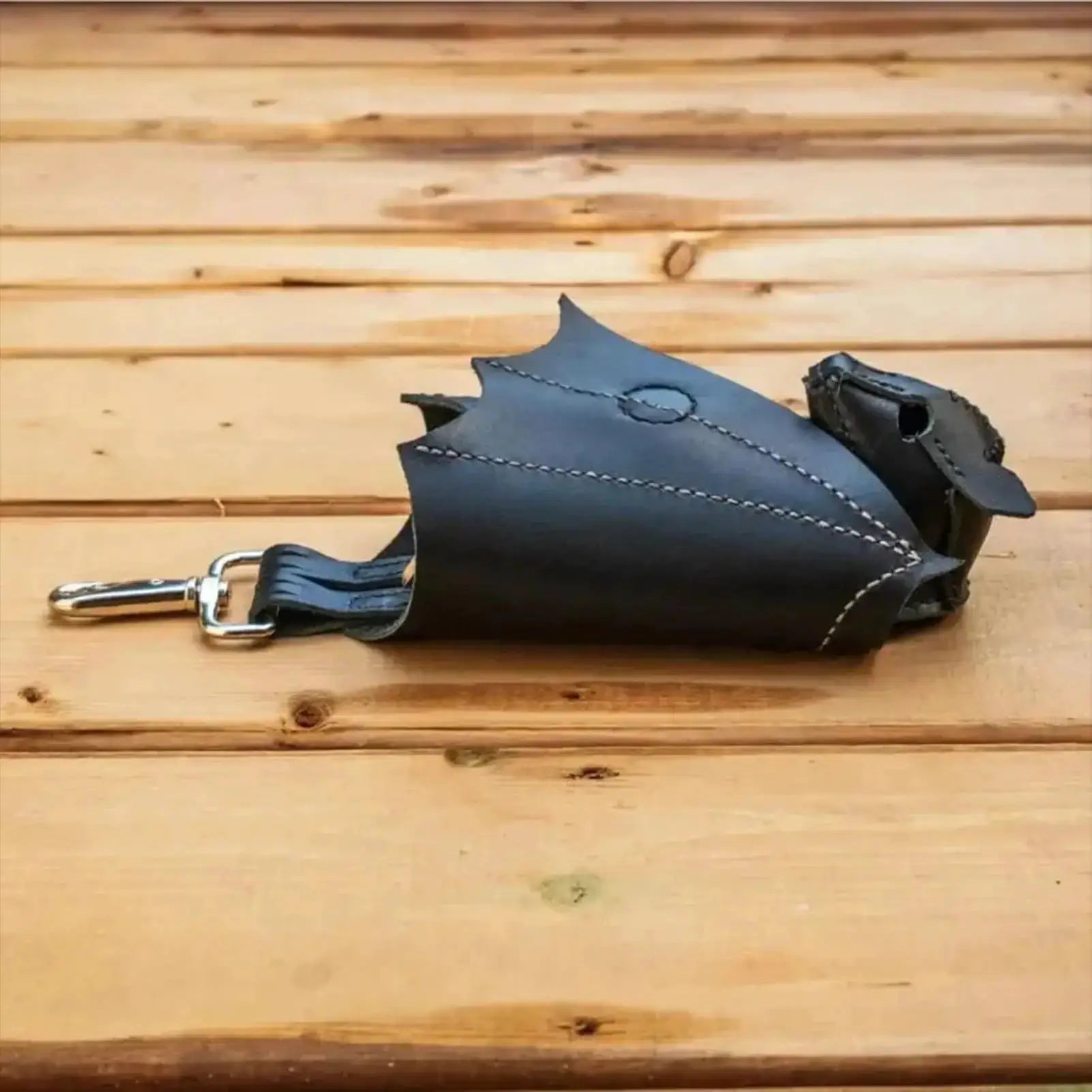 Bat-shaped PU leather coin purse from Simples Market with foldable wings and keychain clip