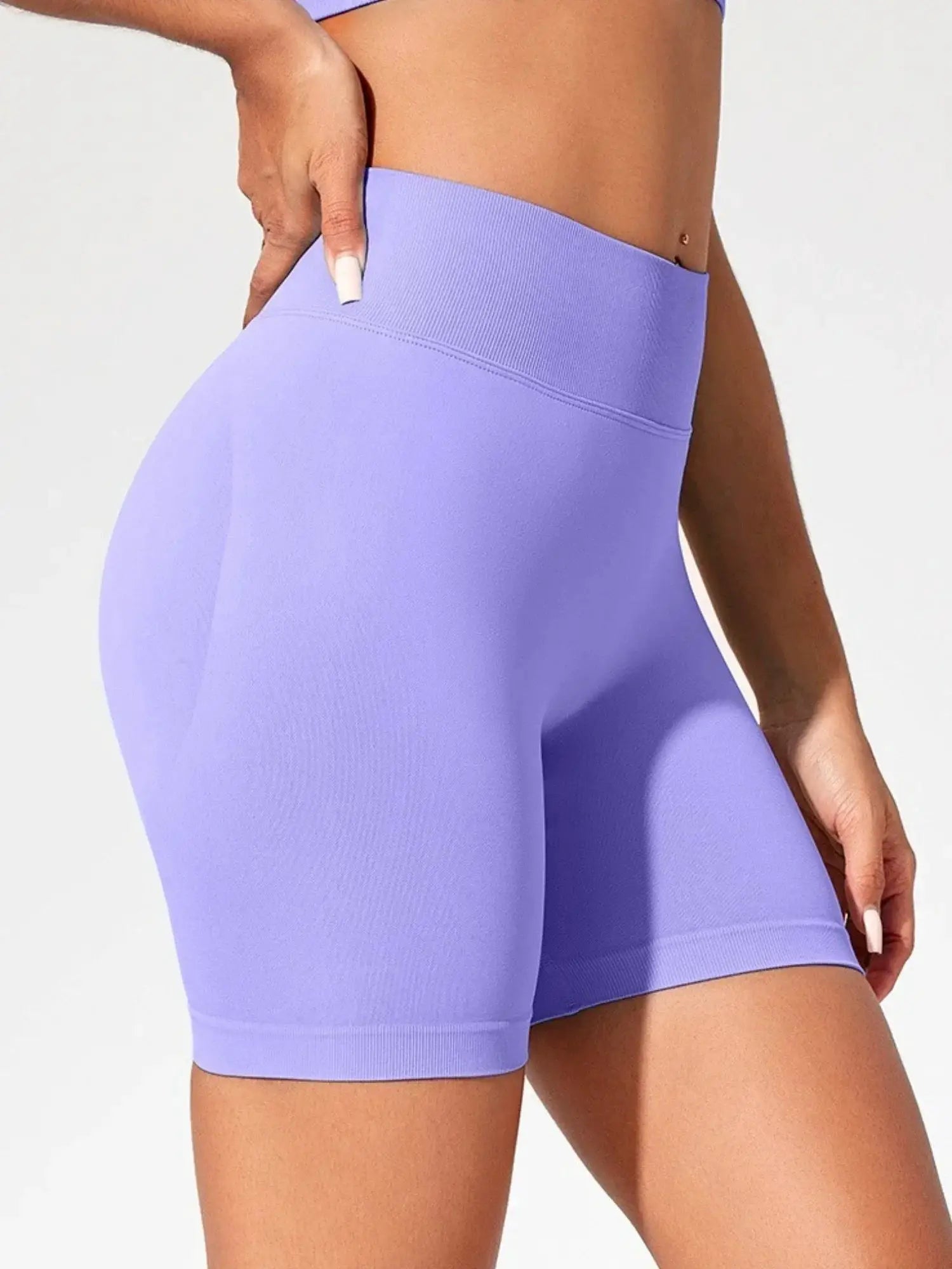 Women’s lavender seamless high-waist gym shorts; mid-thigh length, stretchy fabric