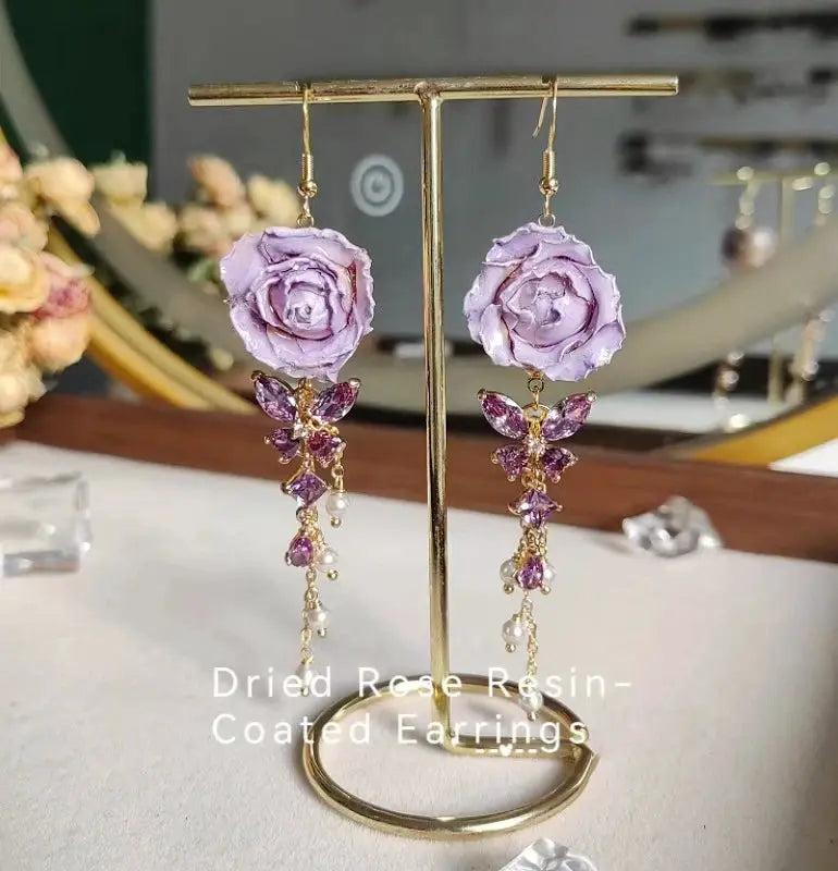 Dried rose epoxy resin long earrings pair, purple with gold-tone drops and crystal petals, Simples Market