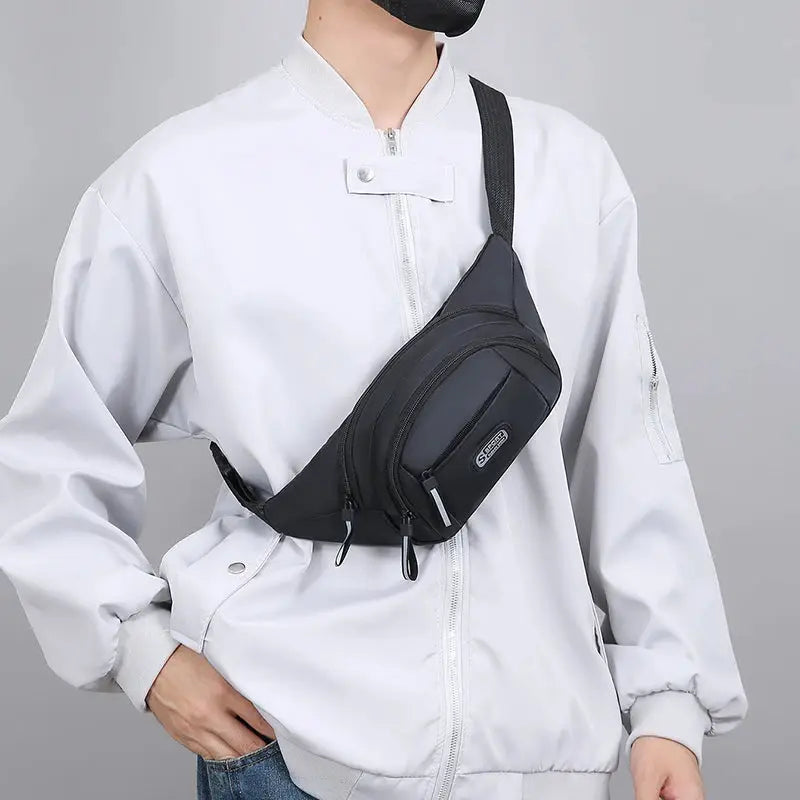 Men's black waist bag with dual zip compartments and an adjustable strap