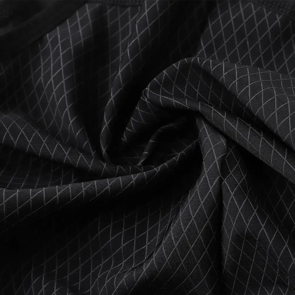 YKYWBIKE cycling bib shorts fabric close-up, black with white grid pattern