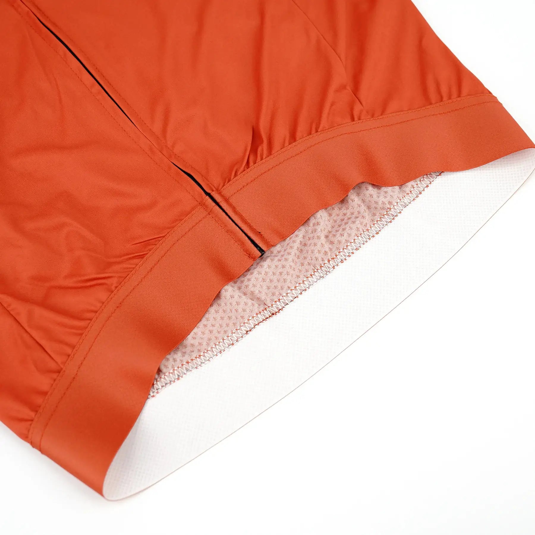 DAREVIE cycling jersey orange with breathable mesh interior at cuff