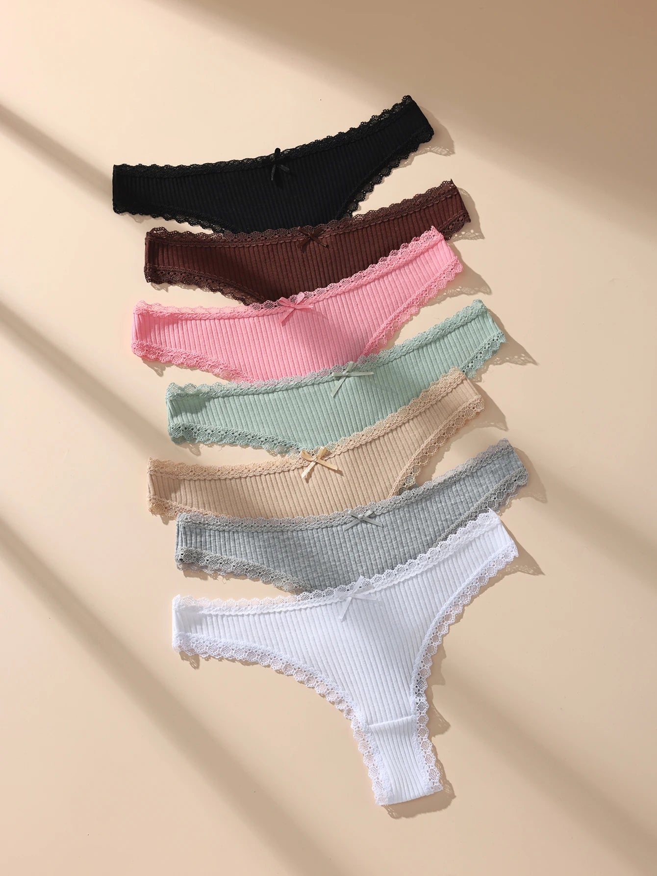 7-piece women's thong panty set with cotton fabric and lace trim in black, maroon, pink, mint, beige, blue, white