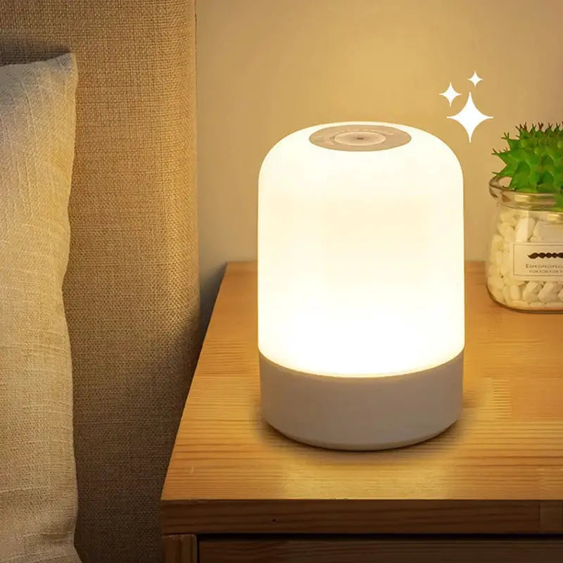LED night light bedside lamp with white base, frosted cylindrical shade, warm glow, touch control