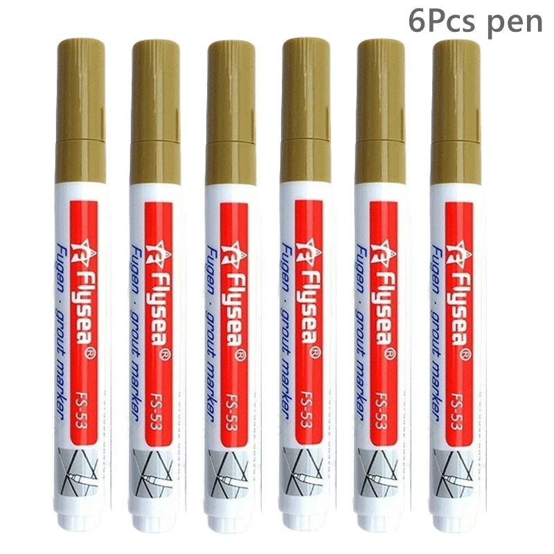 Six grout marker pens with beige caps and white bodies for tile seams and grout repairs