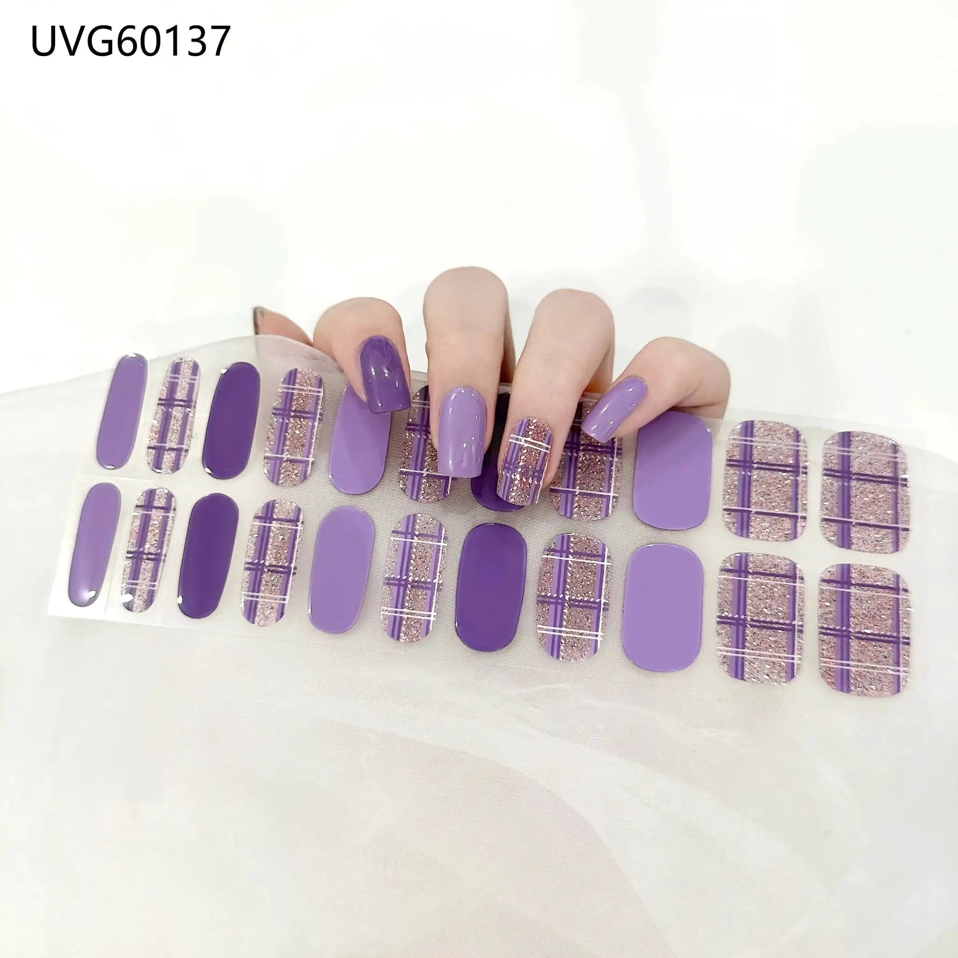 Gel nail wraps set by Simples Market; full-cover lavender purple with glitter plaid accents