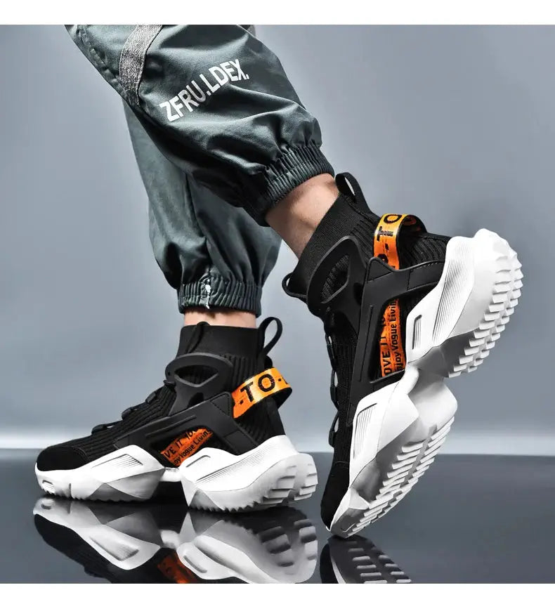 Men's high-top sport sneakers with black mesh, orange pull tabs, and chunky white soles