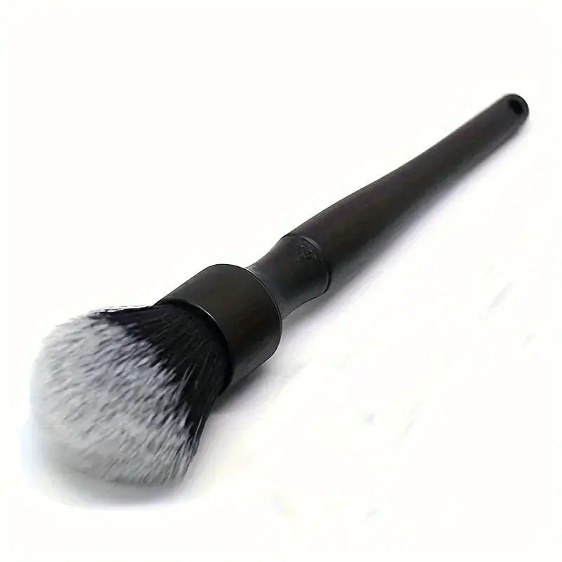 Car detailing brush by Simples Market with black handle and white-tipped synthetic bristles