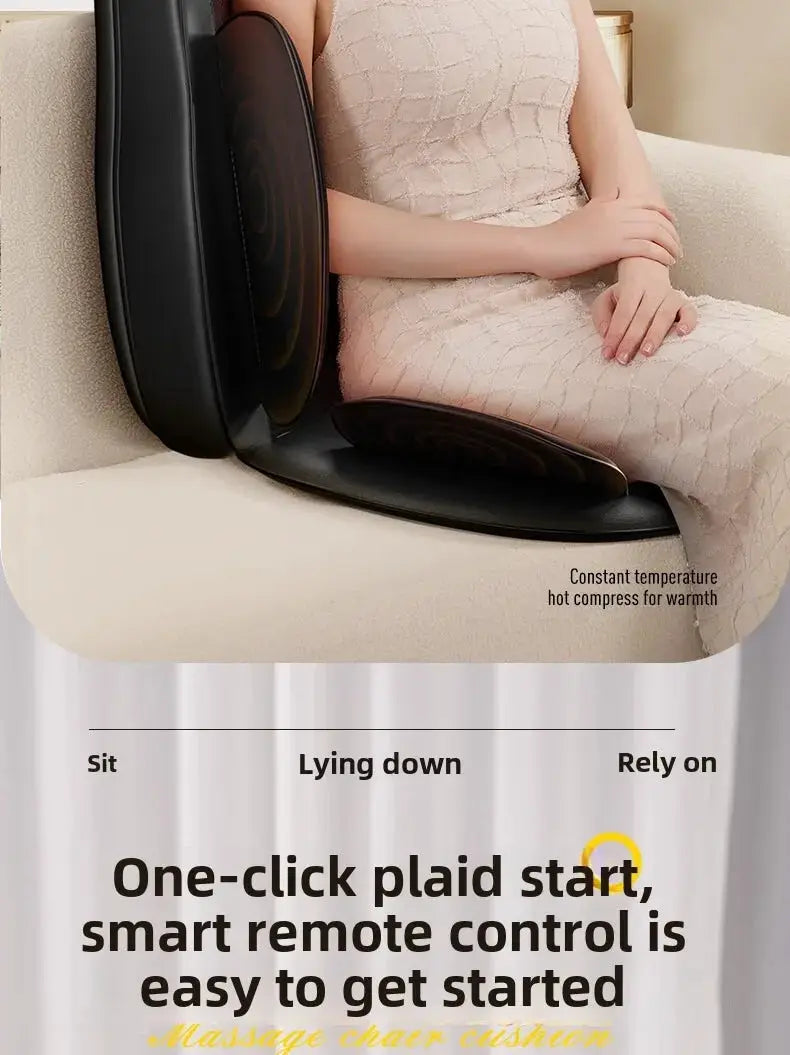Black electric full-body massage chair cushion on a beige sofa with a seated person